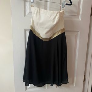 Express White and black strapless dress with gold trim. Never worn.